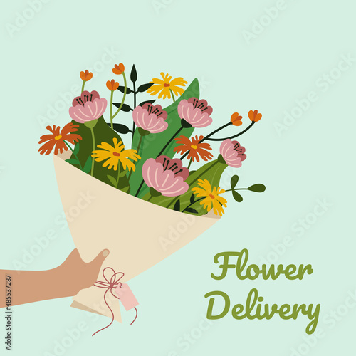 Bouquet of flowers in hand. Concept of flower delivery.