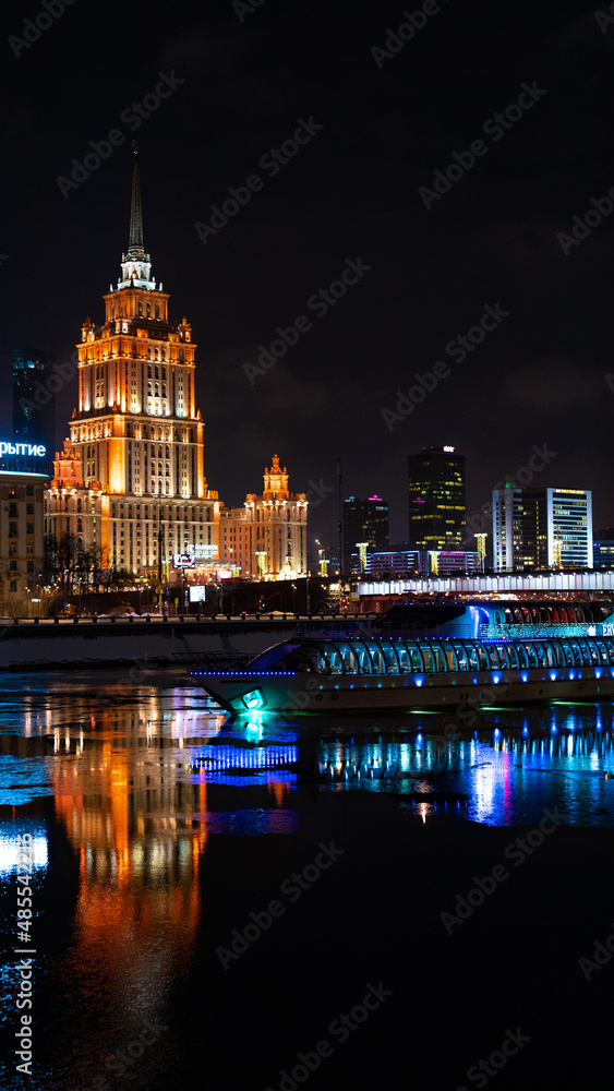 night view of the city with river and boat