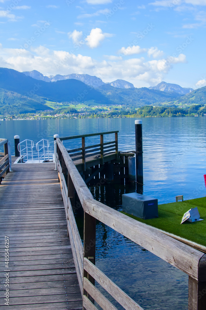 photo background view of the expanse of Lake Traunzi and the wooden bridges of the yacht pier in the vicinity of gmunden, austria, europe