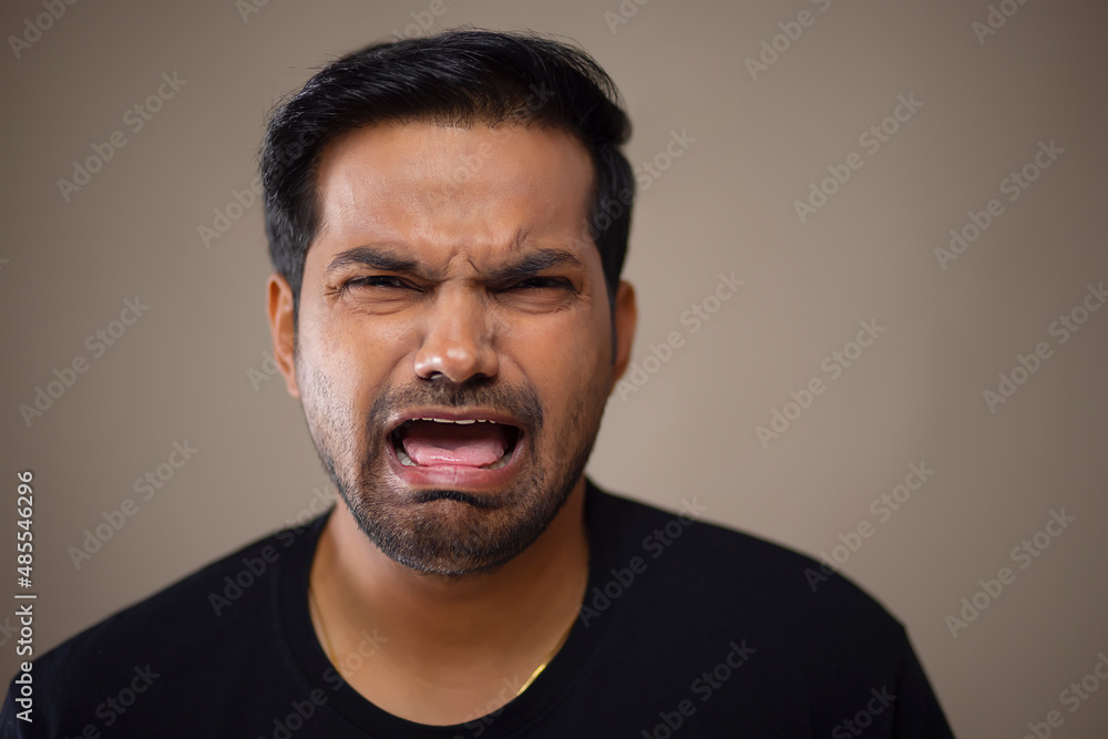 Portrait of a young man crying in front of camera Portrait of a young man crying in front of camera
