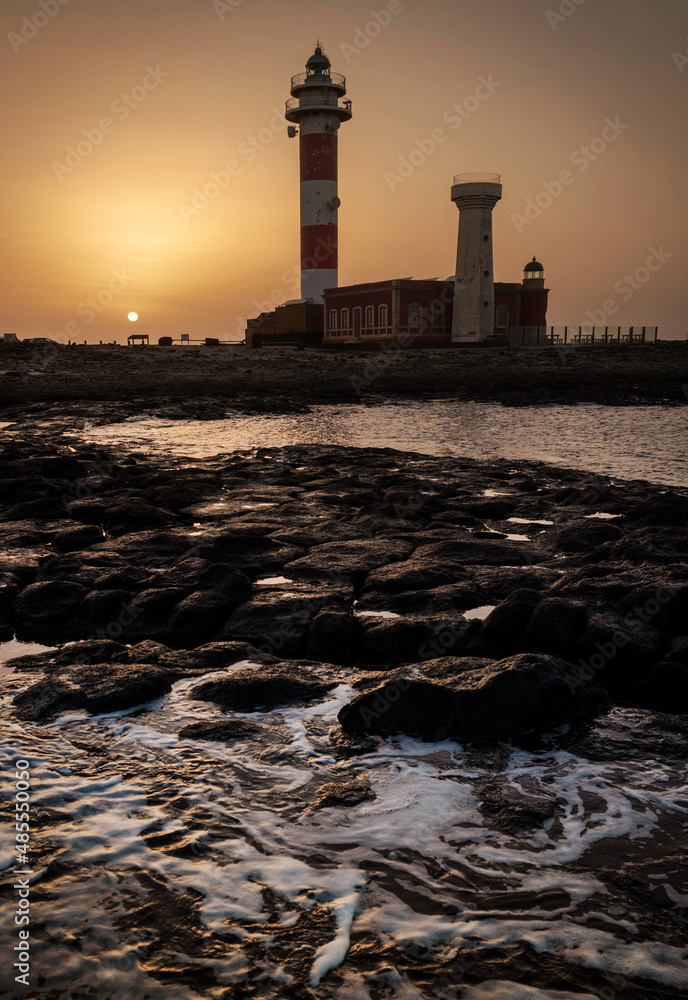 Fototapeta premium Tostón Lighthouse at sunset, El Cotillo, La Oliva, Fuerteventura, Canary Islands, Spain 
