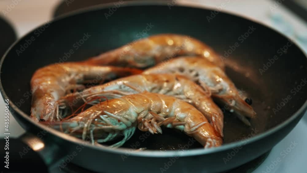 Cooking king prawns in a pan. Cooking king prawns in a pan.