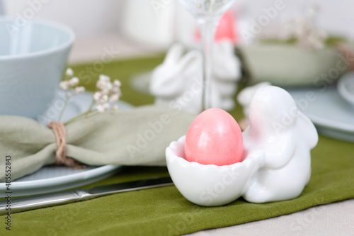 Beautiful Easter table setting with blue plate
