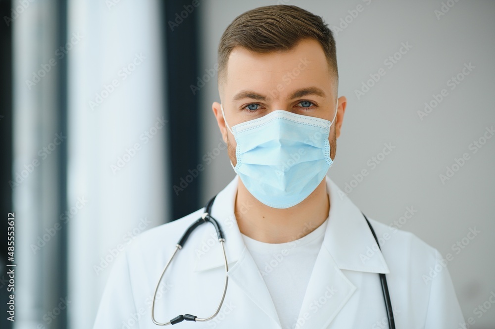 doctor man puts on a protective mask doctor man puts on a protective mask