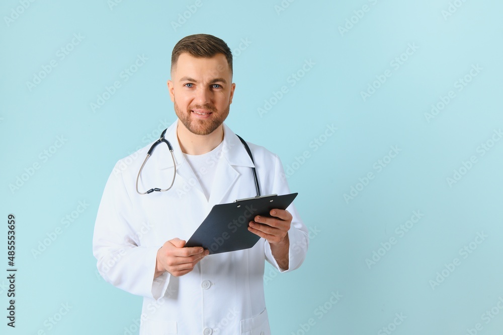 closeup of showing a tablet holding in hands by a male doctor who has a pretty smiley. closeup of showing a tablet holding in hands by a male doctor who has a pretty smiley.