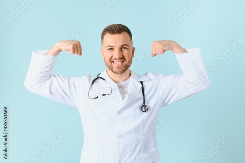 male doctor show strong arm to you