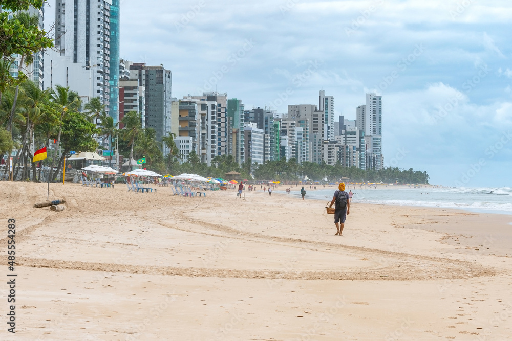 View to the beach of Boa Viagem in Recife, PE, Brazil and the buildings of the city on background. Morning at the beach of the brazilian northeast coast. View to the beach of Boa Viagem in Recife, PE, Brazil and the buildings of the city on background. Morning at the beach of the brazilian northeast coast.