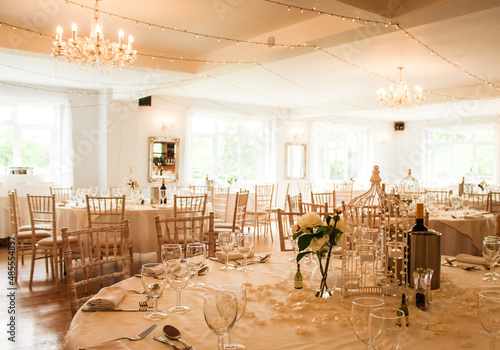 Tables, chairs and cutlery laid out at a wedding venue in Hampshire, UK.