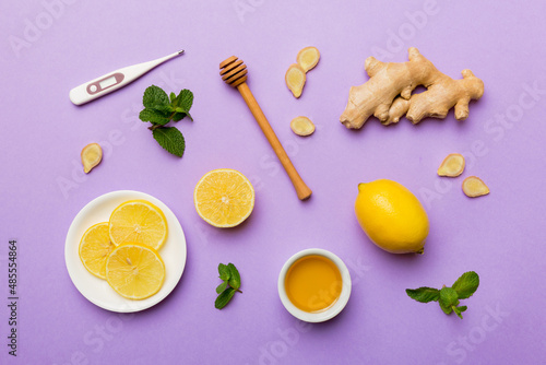 Natural cold and flu home remedies and thermometer. Natural ingredients for immunity stimulation and viruses protection. top view flat lay © sosiukin