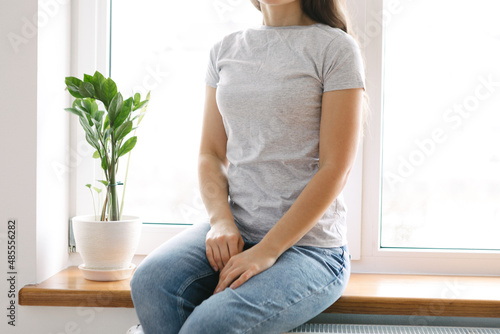 Woman wearing white blank t-shirt with space for your logo