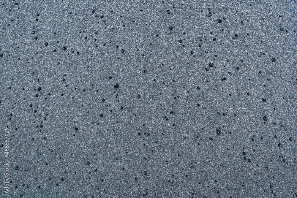 Macro texture on a sprayed metal surface with black paint Macro texture on a sprayed metal surface with black paint