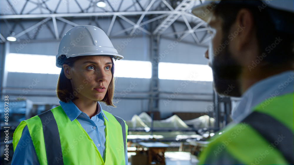 Portrait manufacture workers talking about shipment industry analysing delivery Portrait manufacture workers talking about shipment industry analysing delivery