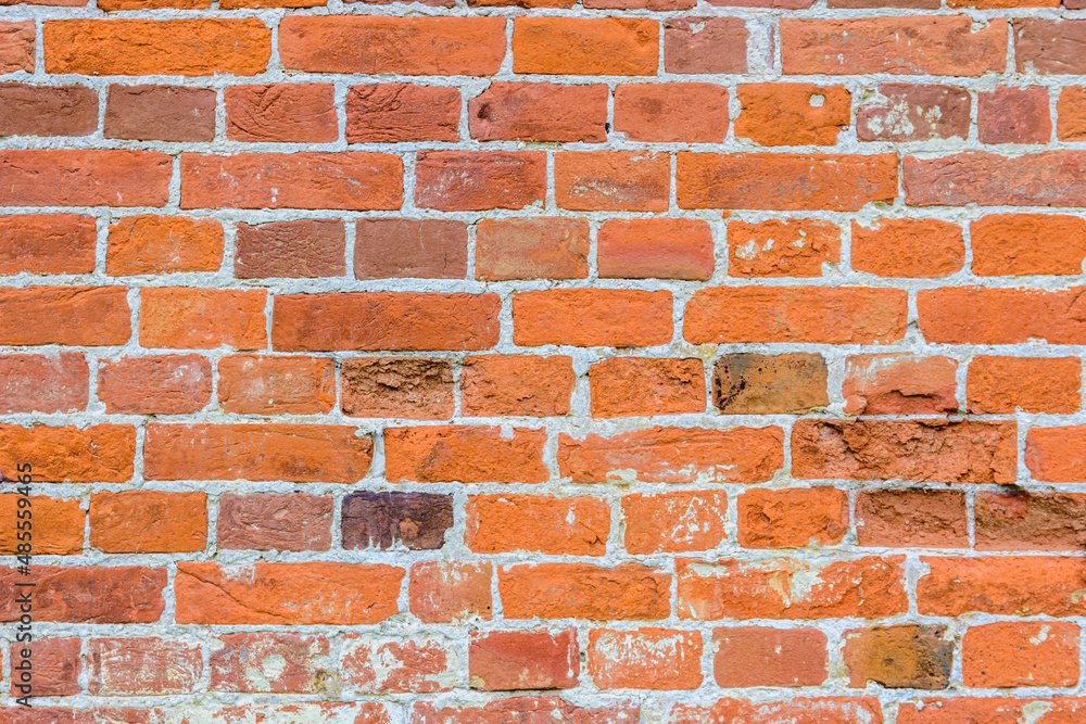 Naklejka premium Old wall of red bricks for the background
