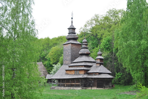 An old wooden church in Ukraine. Rural landscape with a church. Wooden Ukrainian church. The green landscape of the countryside. Kiev. Ukraine.