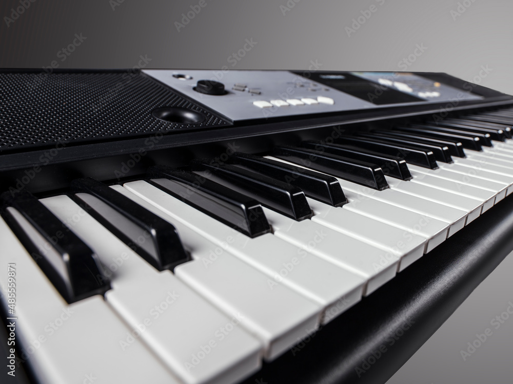 Piano keyboard. Music background. Play piano. Synthesizer on a dark  background with a gradient. Professional analog synth device with classic  pianist keyboard and regulators. Stock Photo | Adobe Stock