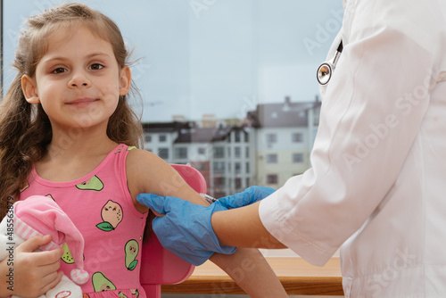 vaccination of children. Doctor examining a child in a hospital