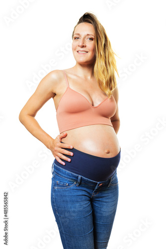 Happy pregnant woman hold big belly over white © Sergey Novikov