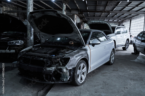 Repair of an old broken car at auto service