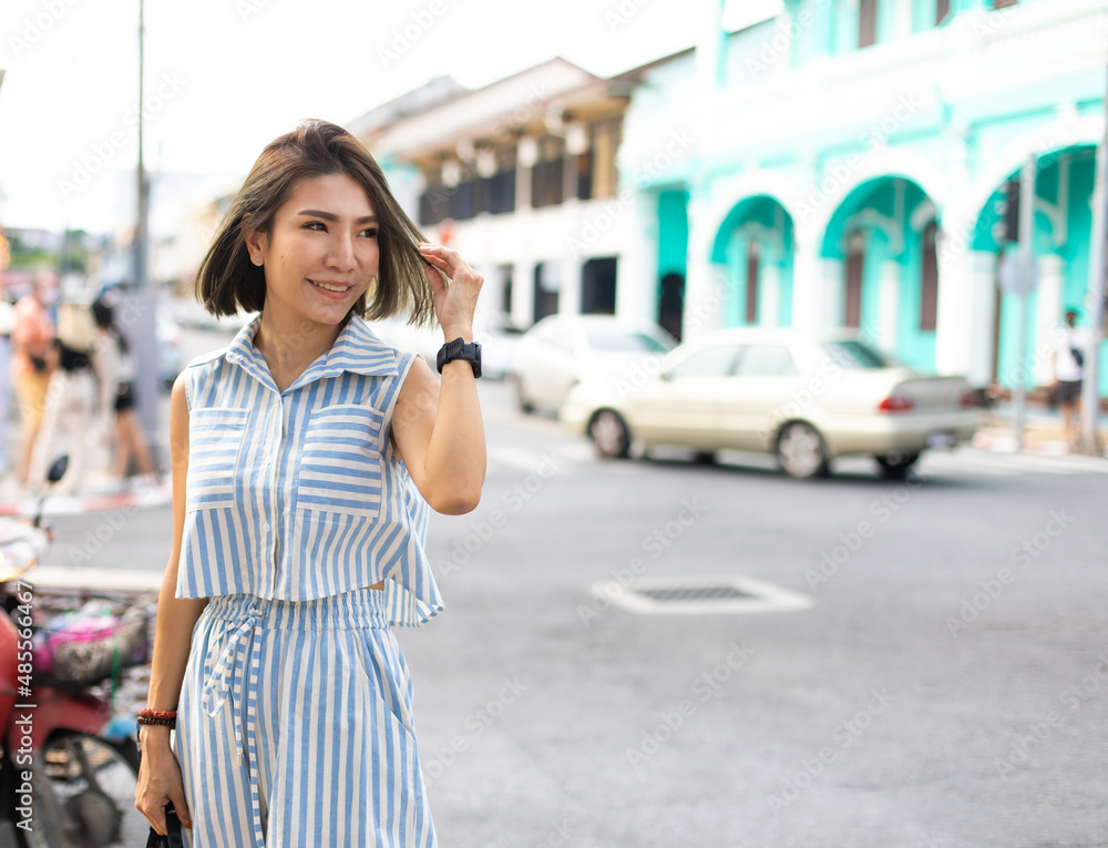 Happy beautiful Asian woman enjoys travel Vacation summer holidays in city. Asian female traveler. Happy beautiful Asian woman enjoys travel Vacation summer holidays in city. Asian female traveler.
