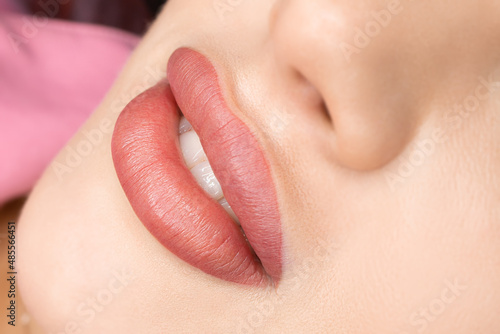 permanent lip makeup completed the procedure a beautiful smile with tattooed lips