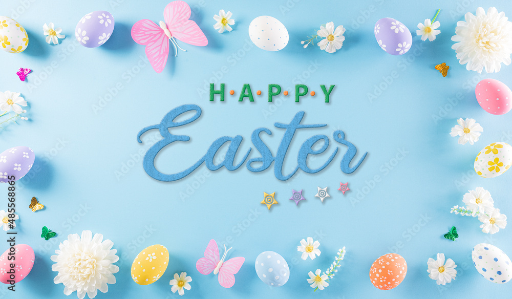 Happy easter! Colourful of Easter eggs in with flower on pastel blue background. Greetings and presents for Easter Day celebrate time. Flat lay ,top view with the text.