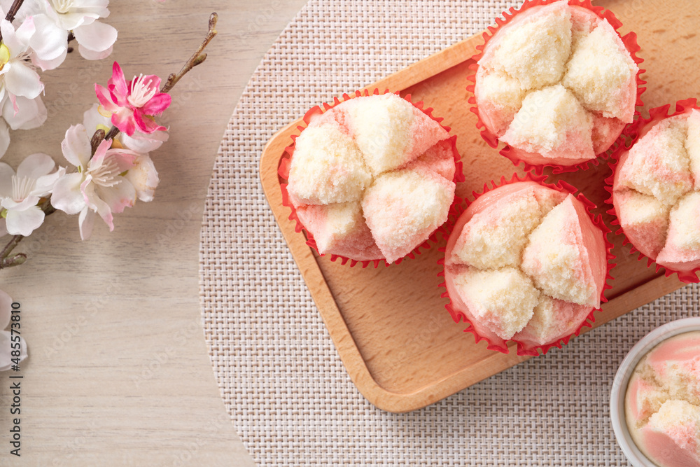 Cute Chinese steamed sponge cake - Fa Gao on wooden table background for spring festival celebration food.