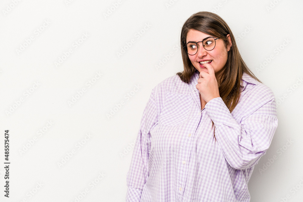 Young caucasian overweight woman isolated on white background relaxed thinking about something looking at a copy space. Young caucasian overweight woman isolated on white background relaxed thinking about something looking at a copy space.