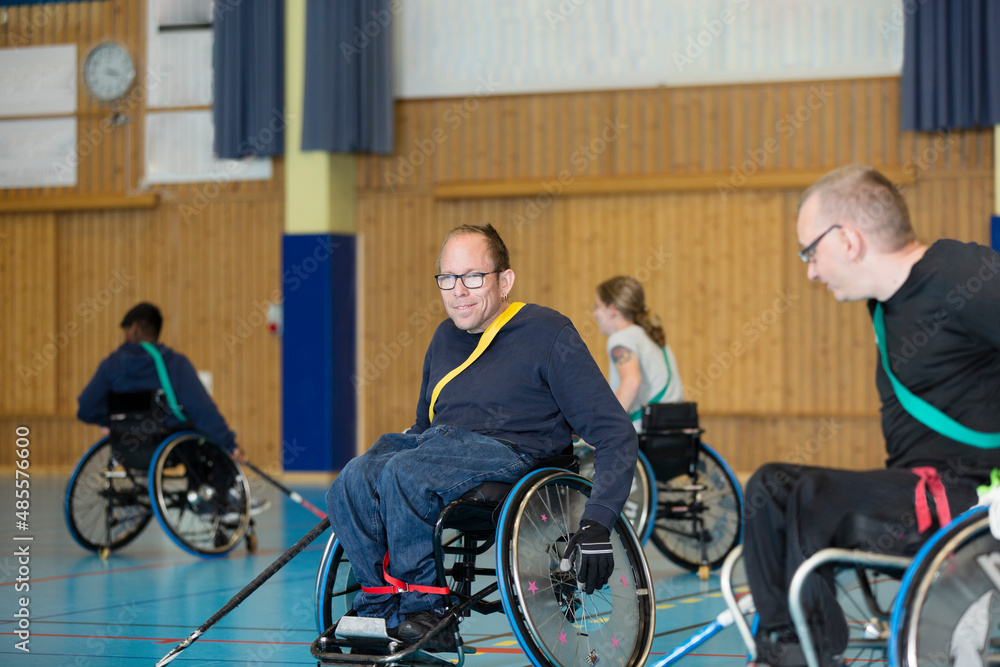 Disabled people playing in gym Disabled people playing in gym