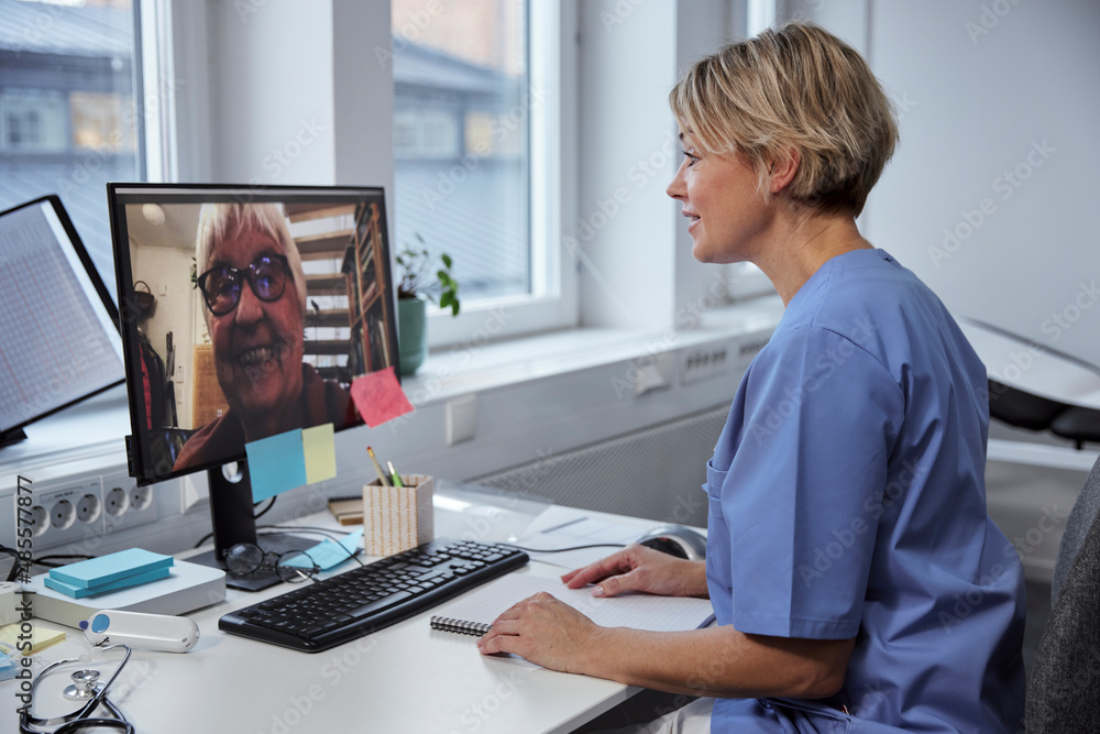 Female doctor having online consultation with senior patient Female doctor having online consultation with senior patient