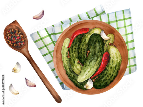 A plate of gherkins, pickles. Wooden Spoon filled with spices