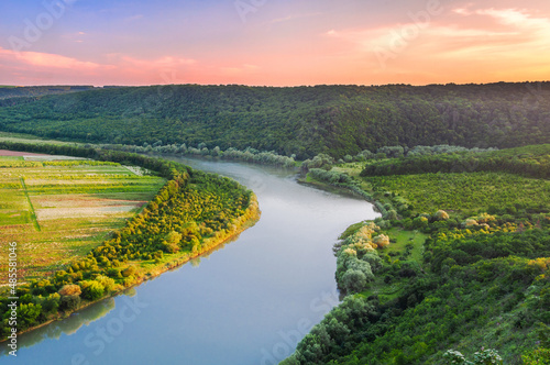 Scenic view from the height of the canyon on the bend of the river and the sky in the colors of the sunset. Dniester Canyon, Ukraine photo