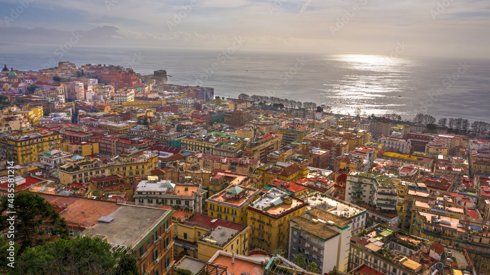Aerial view of the city of Naples and the seafront of Mergellina on a sunny day.