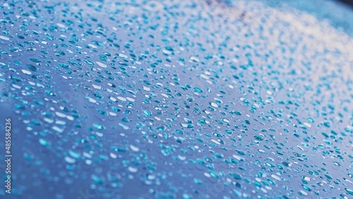 Crystal Clear Drops of Pure Rain Water on Car Windshield