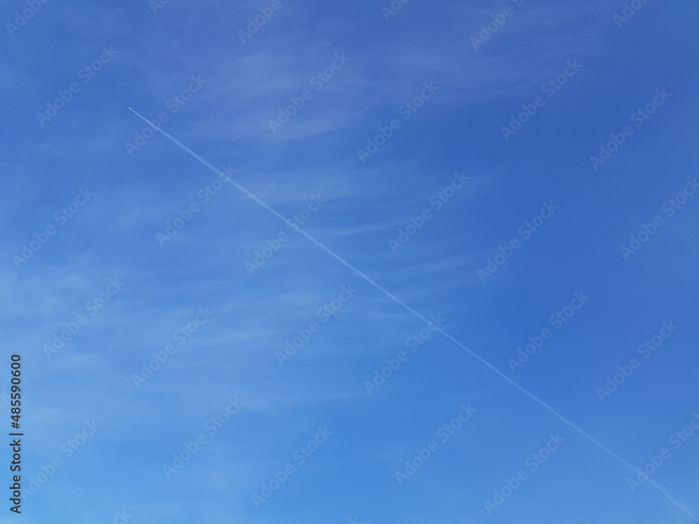 White airplane trail in blue sky White airplane trail in blue sky