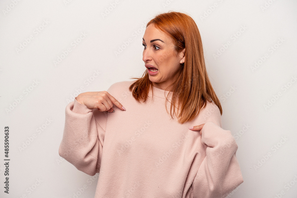 Young caucasian woman isolated on white background surprised pointing with finger, smiling broadly. Young caucasian woman isolated on white background surprised pointing with finger, smiling broadly.