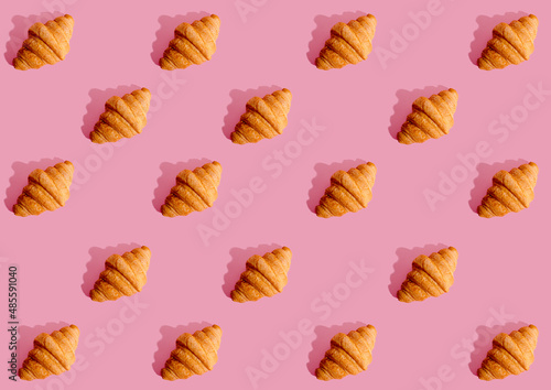 croissant print on pink background with black shadow