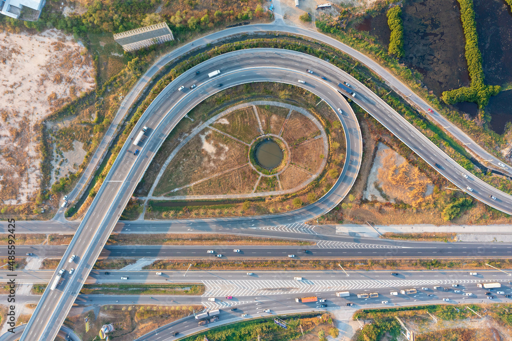 Aerial top view of elevated road and traffic. Modern construction design of traffic ways to avoid traffic jams