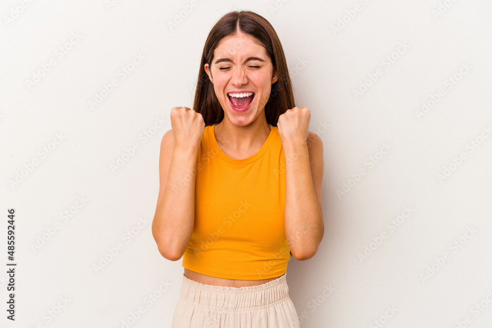 Young caucasian woman isolated on white background cheering carefree and excited. Victory concept. Young caucasian woman isolated on white background cheering carefree and excited. Victory concept.