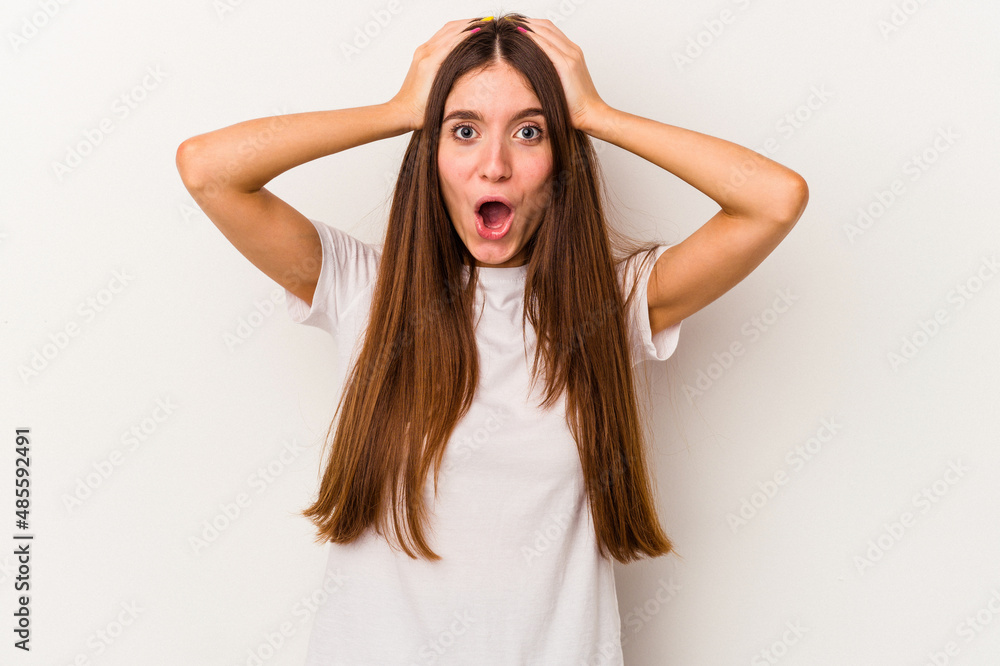 Fototapeta premium Young caucasian woman isolated on white background surprised and shocked.