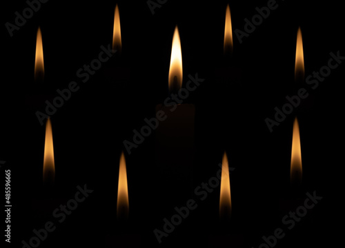 burning candles on a dark background. candle flame.