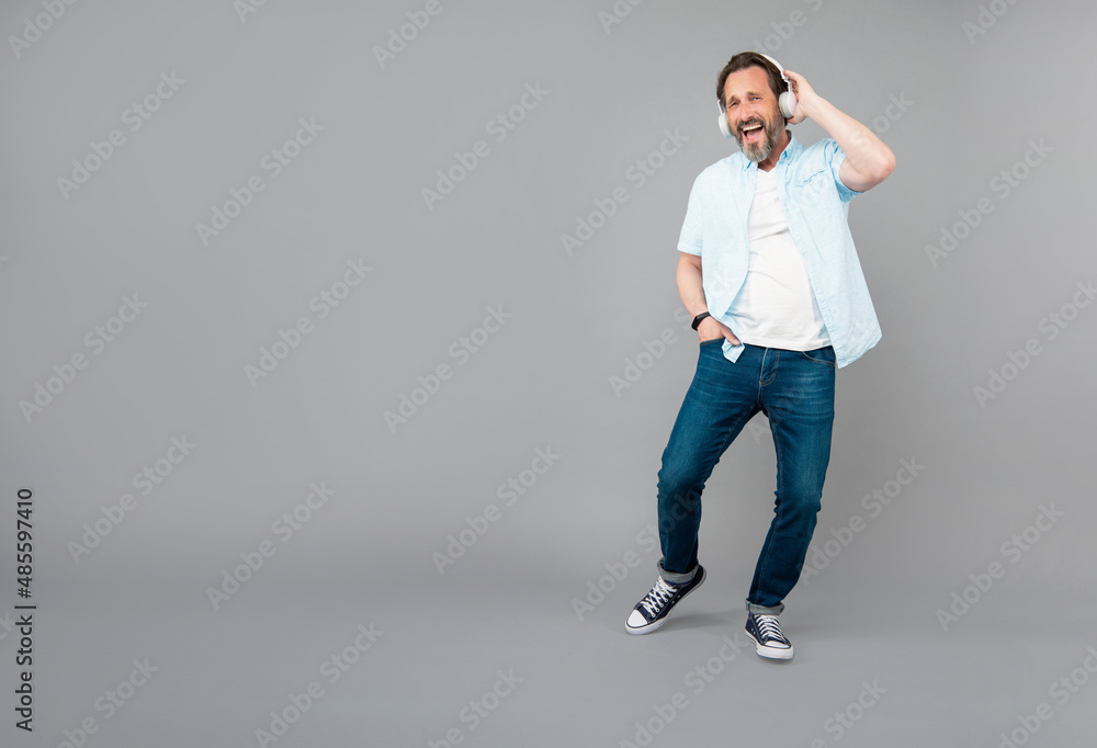 Move with the music. Happy old man sing along to song. Listening to music Move with the music. Happy old man sing along to song. Listening to music