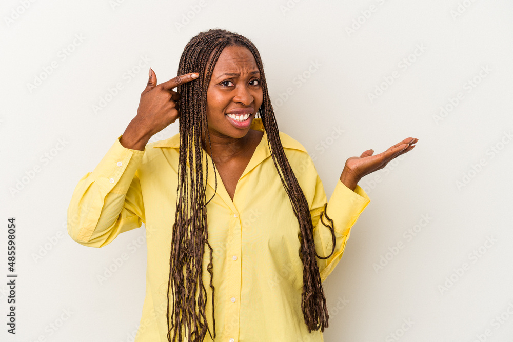 Young african american woman isolated on white background showing a disappointment gesture with forefinger.