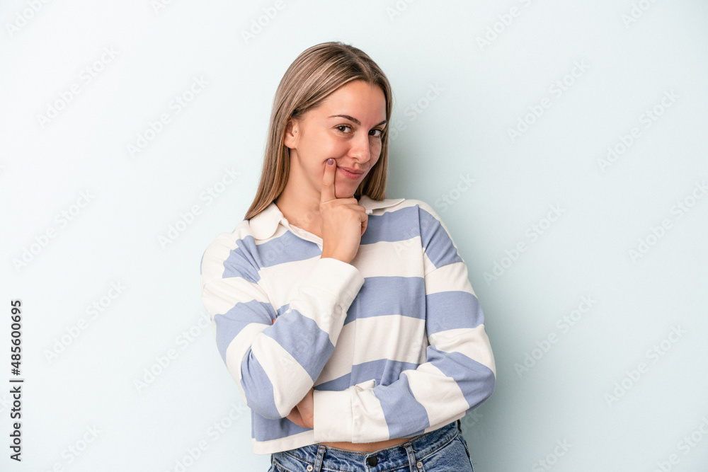 Young caucasian woman isolated on blue background contemplating, planning a strategy, thinking about the way of a business. Young caucasian woman isolated on blue background contemplating, planning a strategy, thinking about the way of a business.
