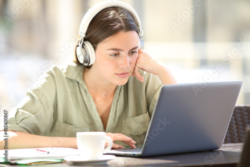 Student e-learning online with headset and laptop