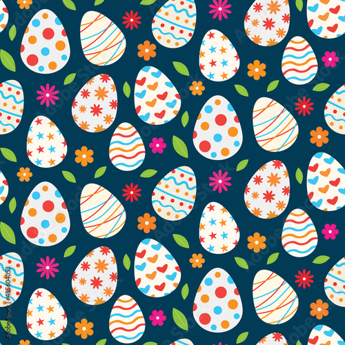 Colorful Easter eggs seamless pattern with flowers and leaves on dark blue background. Great for greeting cards, gift wrapping paper and textile 