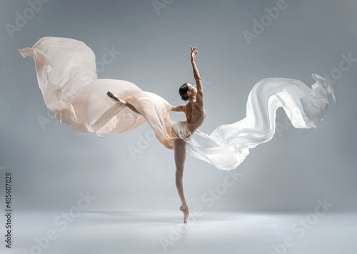 Fototapete Beautiful ballerina dancing in the body color ballet leotard with body color cloth
