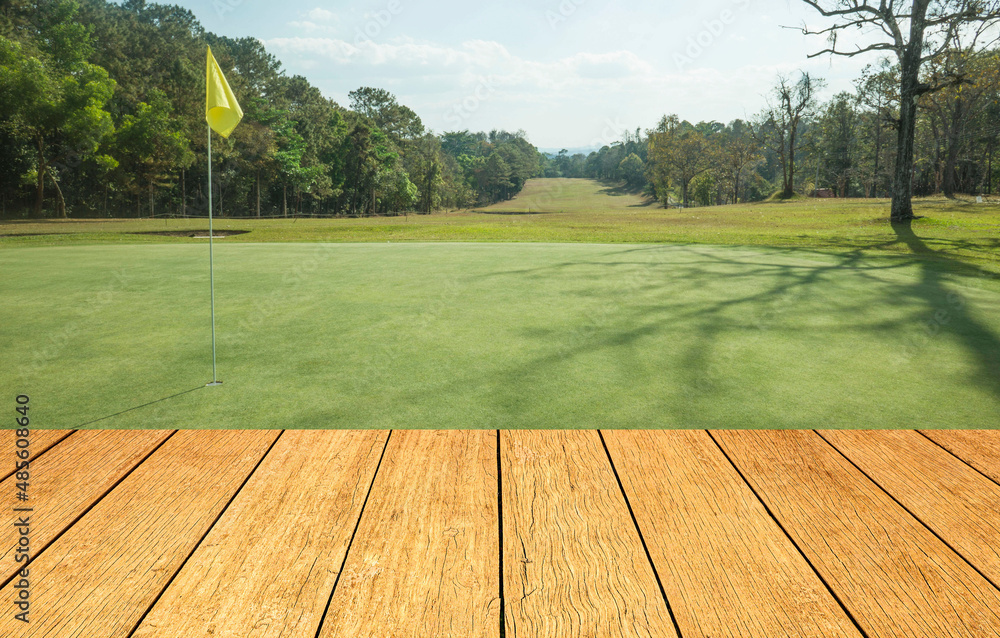 Wooden floor and golf course background. Fresh spring green golf course with wood floor. Beauty natural background, Empty wooden deck table with Green background. Wooden floor and golf course background. Fresh spring green golf course with wood floor. Beauty natural background, Empty wooden deck table with Green background.