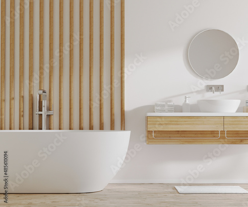 Foto White and light wood bathroom interior with bathtub and sink with cabinets, roun