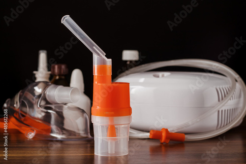 Canvas Print Atomizing cup with nebulizer mouthpiece for compressor inhaler on table