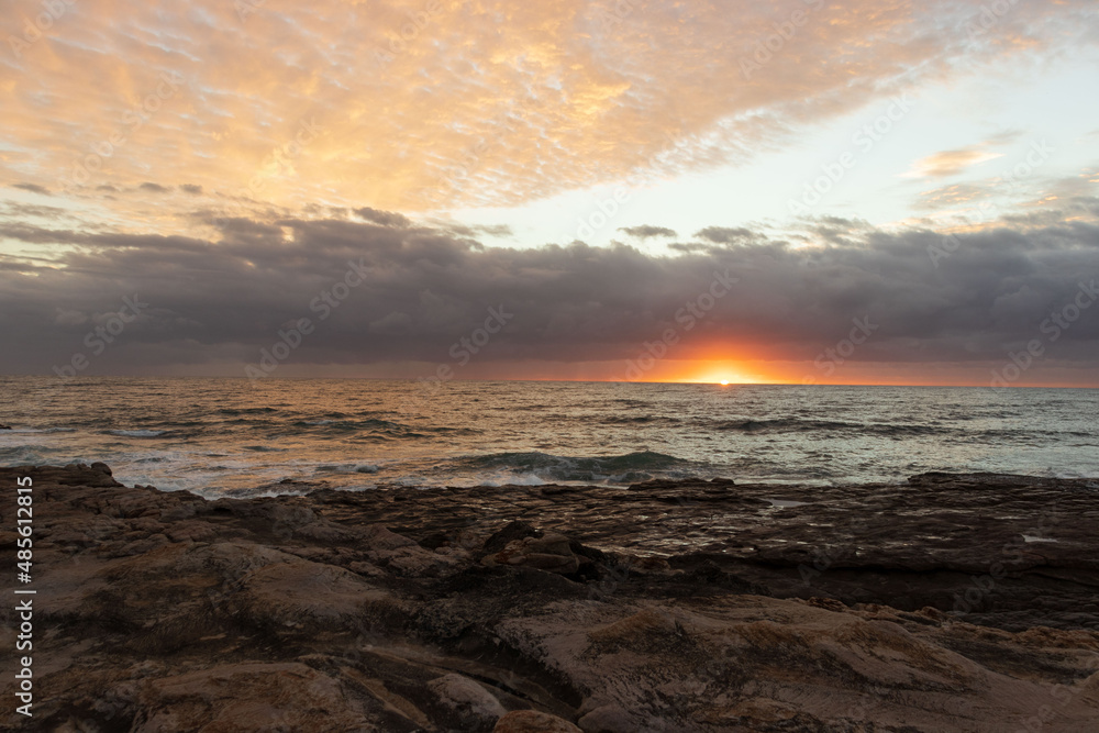 Morning sunrise view of ocean at Orange rocks in Uvongo, East coast of South Africa 